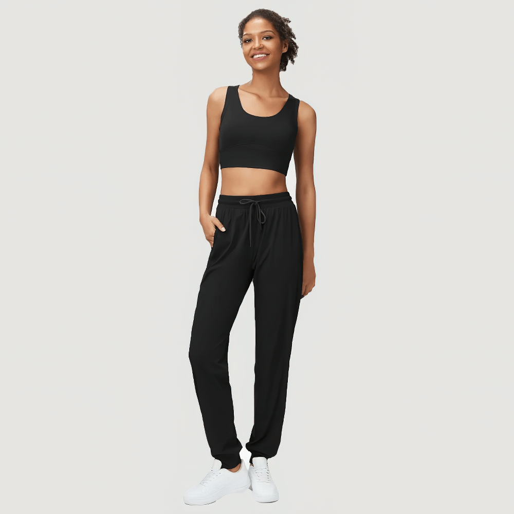 Women's stylish black joggers and sports bra set with drawstring, perfect for active wear or casual outings. SF2089 collection.